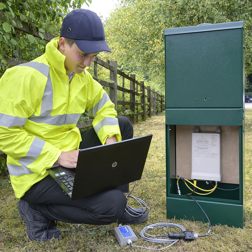 Location photography, Engineer operates a laptop, connected to a meter
